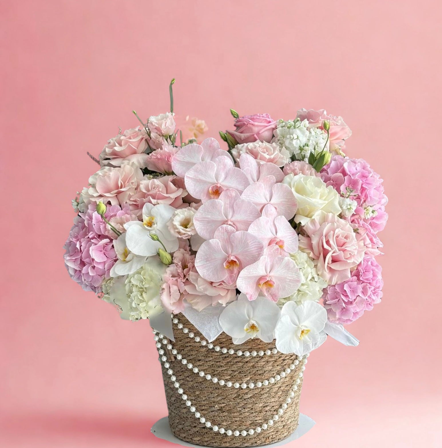 White pinks orchid basket